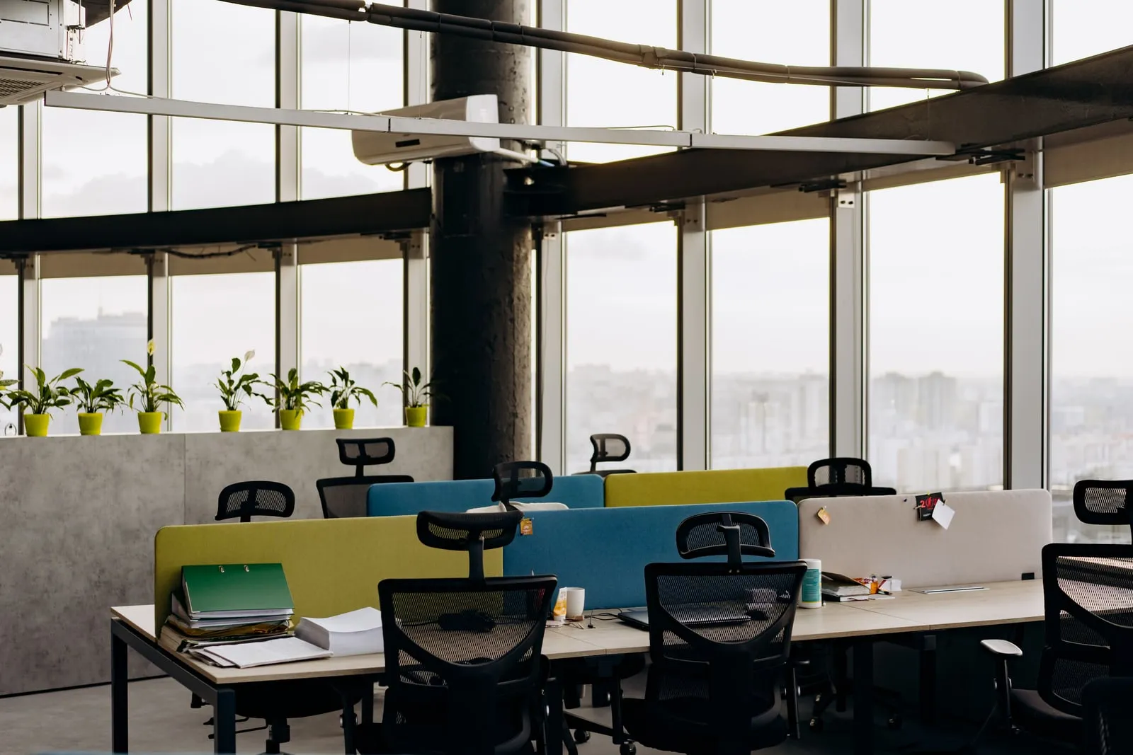 An open plan office interior with empty desks
