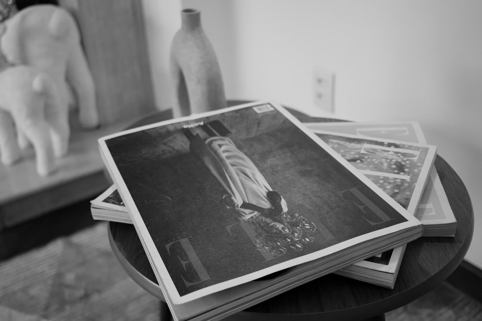 Printed magazines stacked on a table