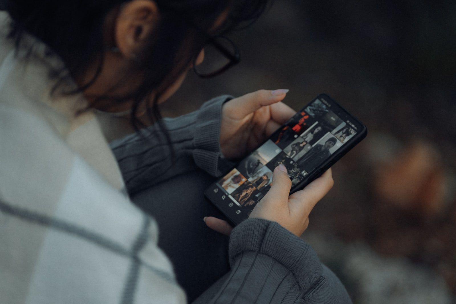A person browsing a photo gallery on a smartphone