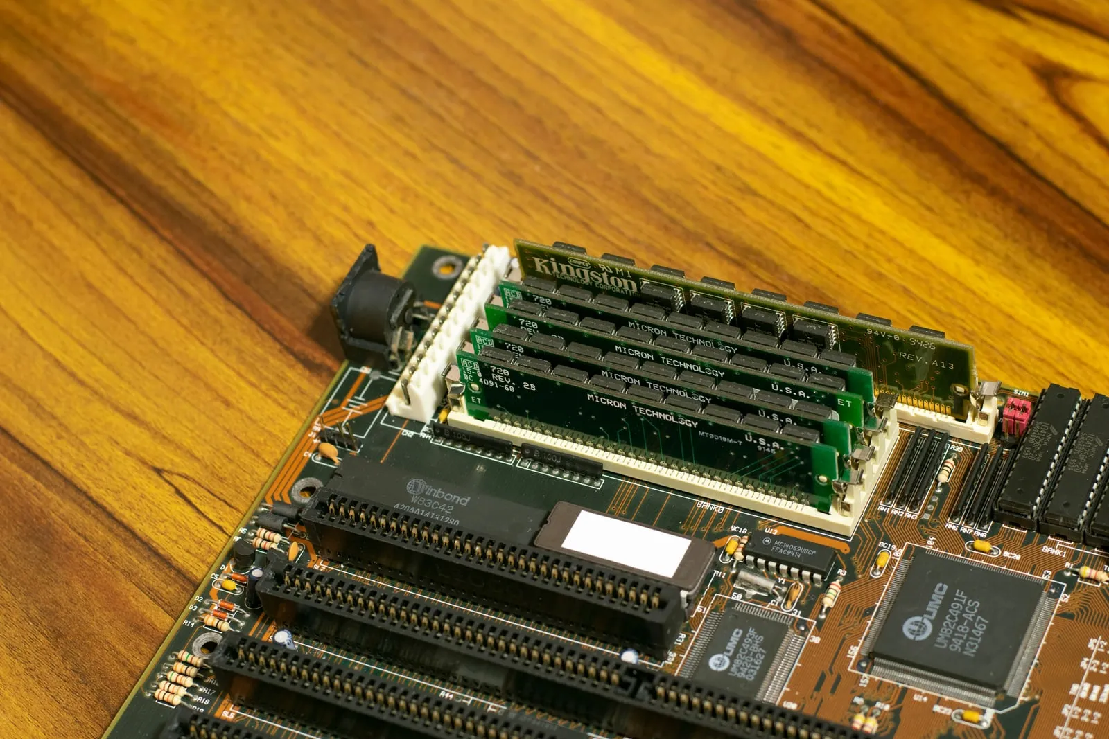 Older Micron memory modules seated on a computer motherboard