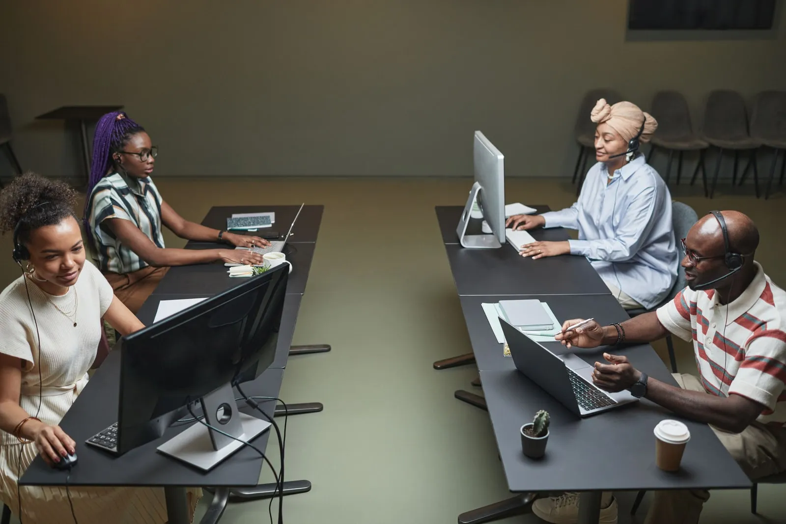 Office workers at desks with computers