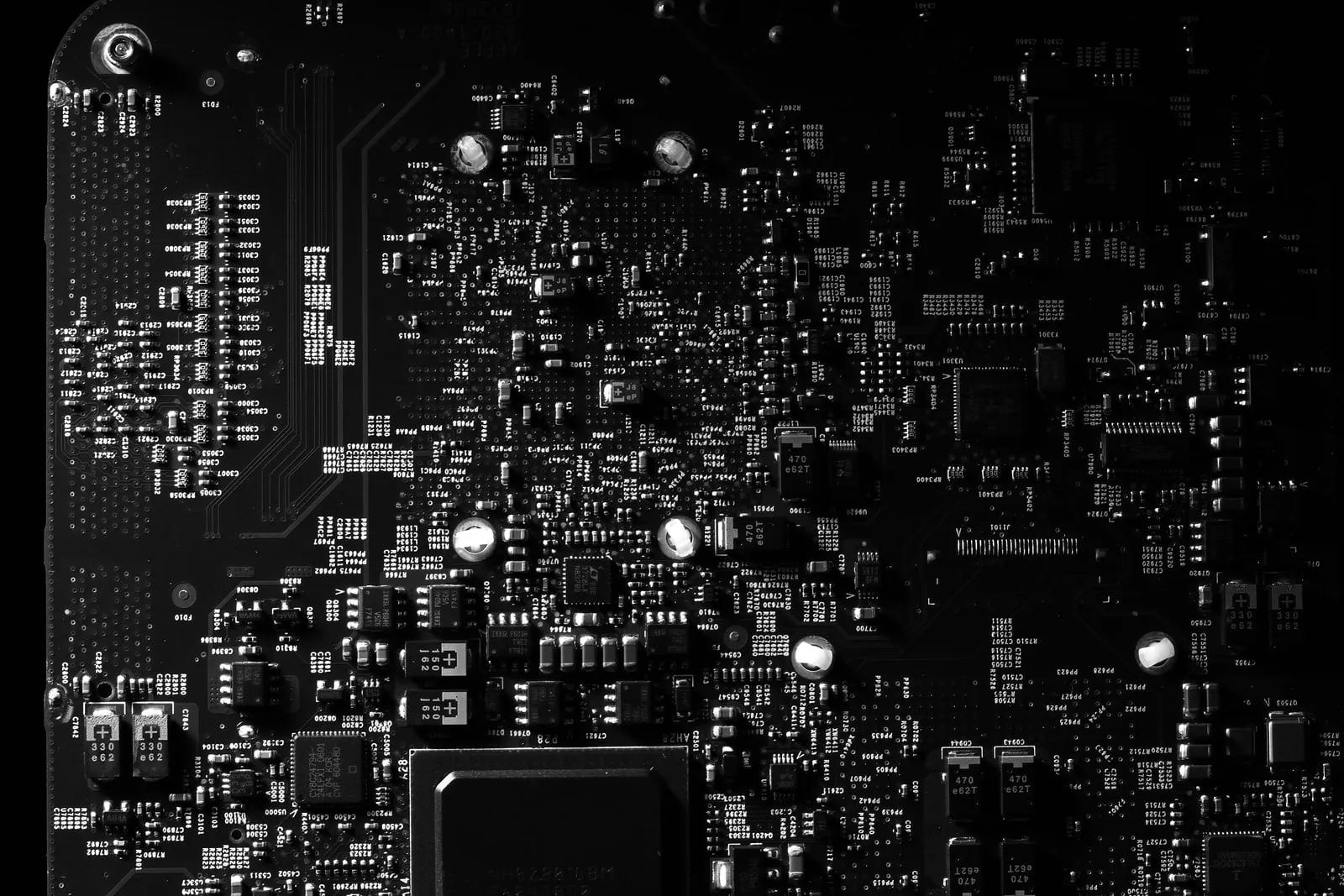 A densely populated circuit board in black and white