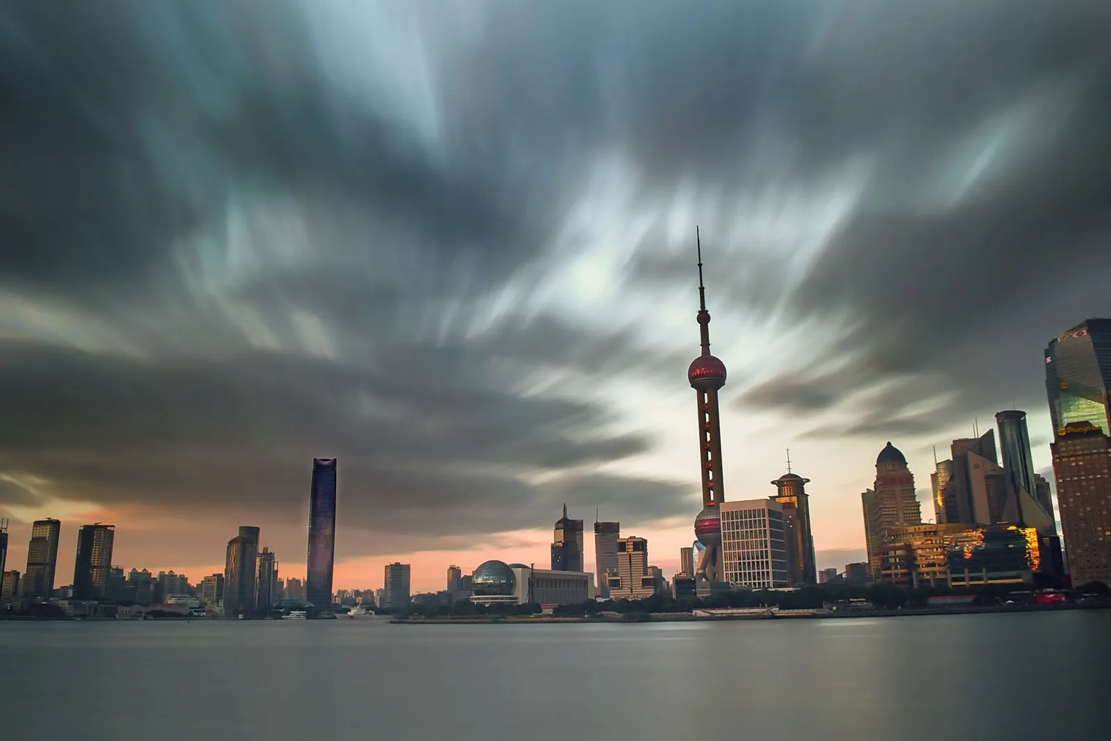 The Shanghai skyline seen across the river at dusk