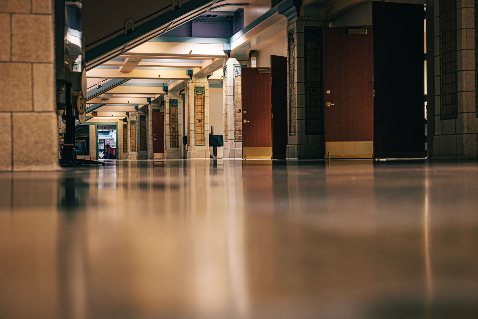 An empty office corridor lined with closed doors
