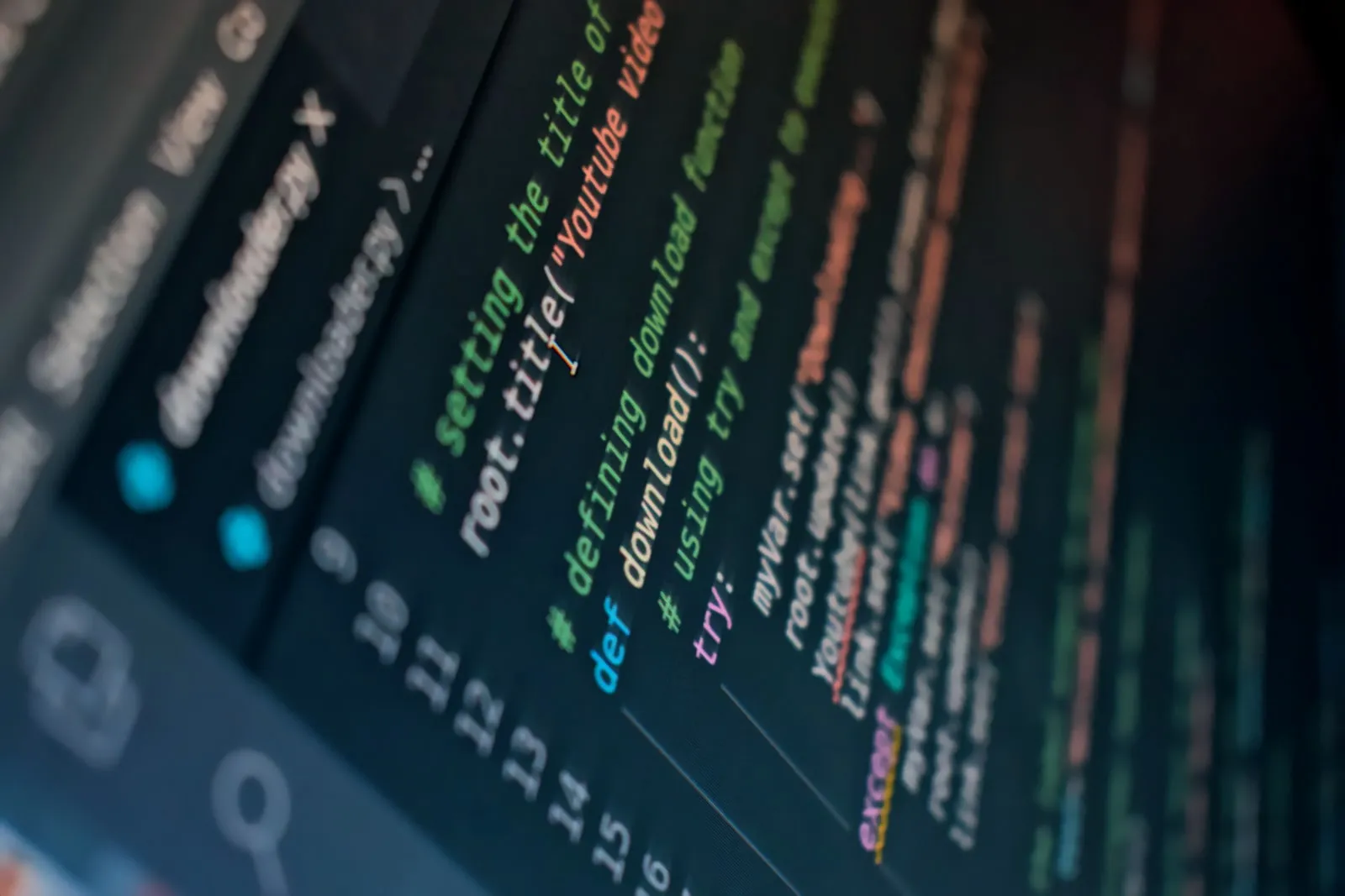 Close-up of programming code displayed on a monitor