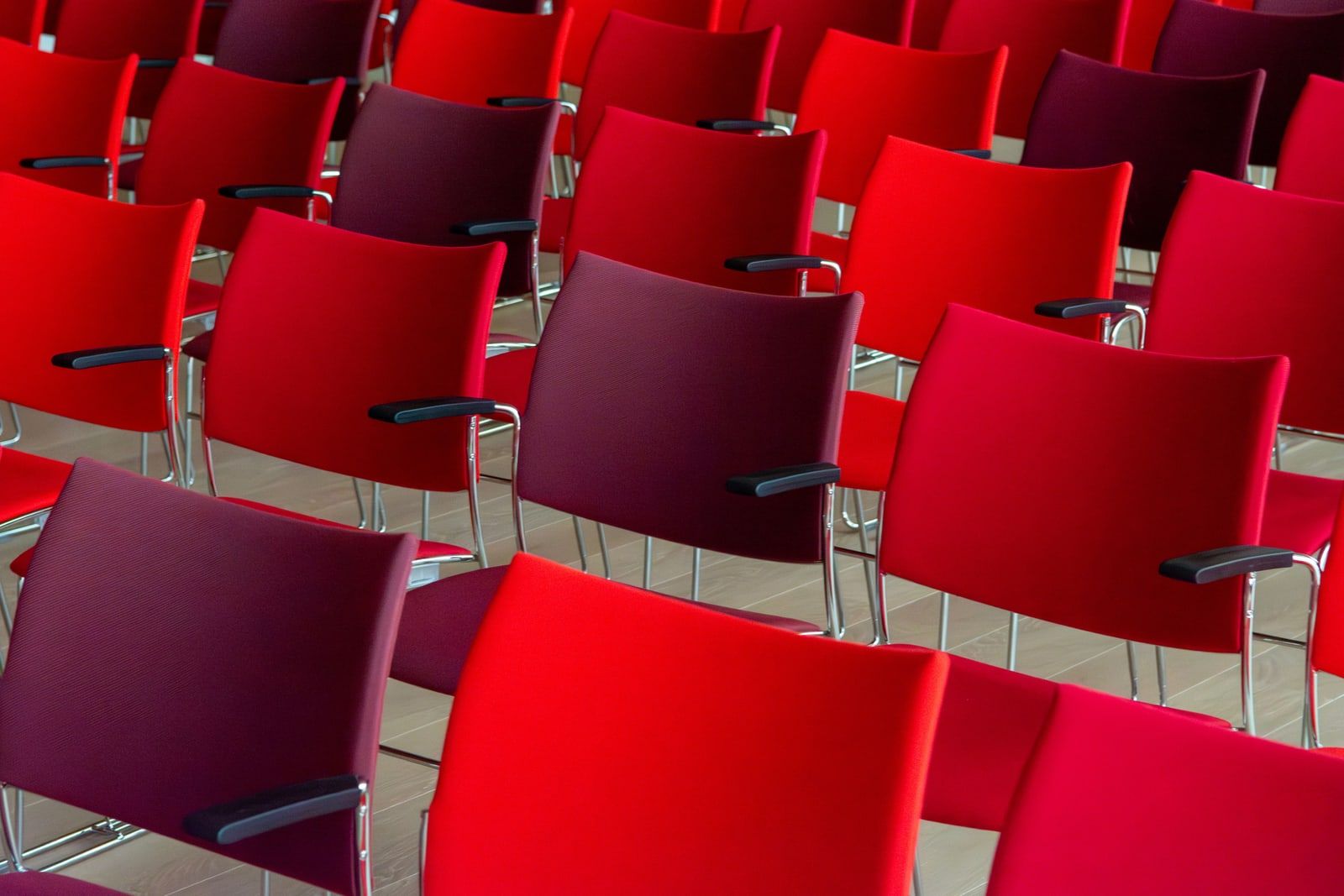 Rows of empty chairs in a conference hall