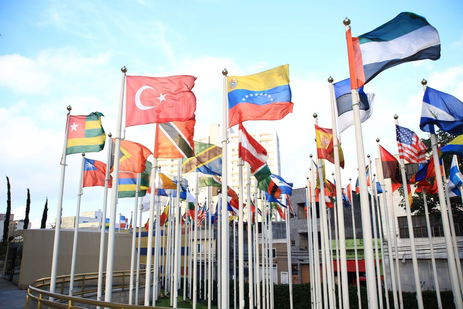 National flags flying outside an international conference centre