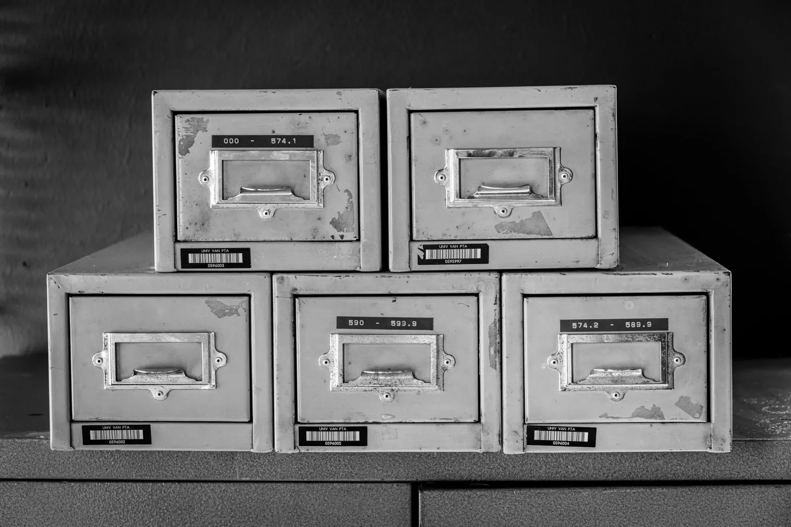 Stacked metal card-index drawers labelled with number ranges