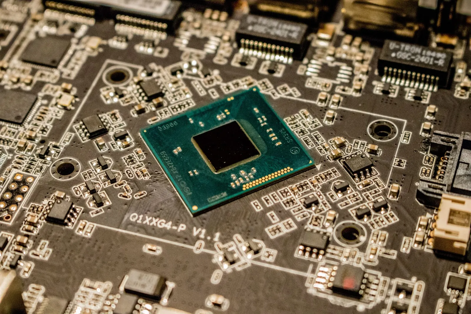 A processor chip mounted on a green circuit board