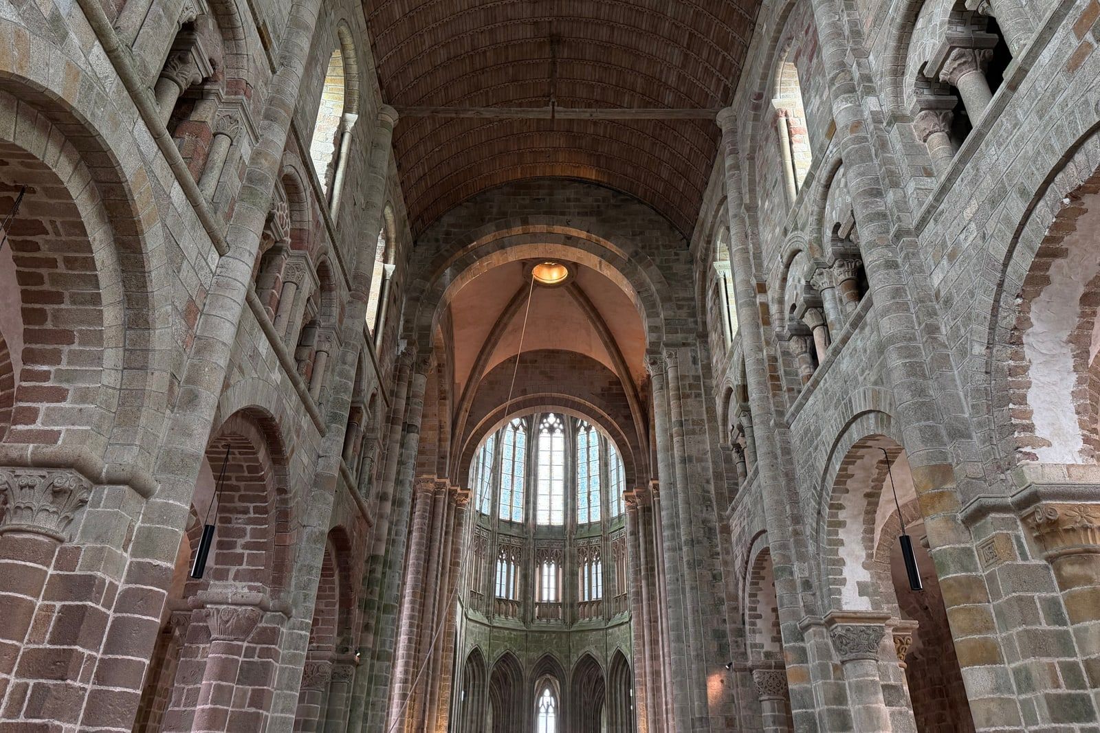 The interior of a stone cathedral with vaulted arches