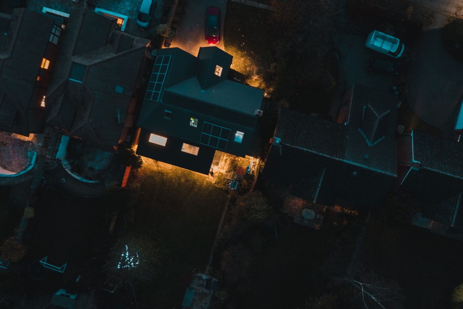 Suburban houses seen from above at night