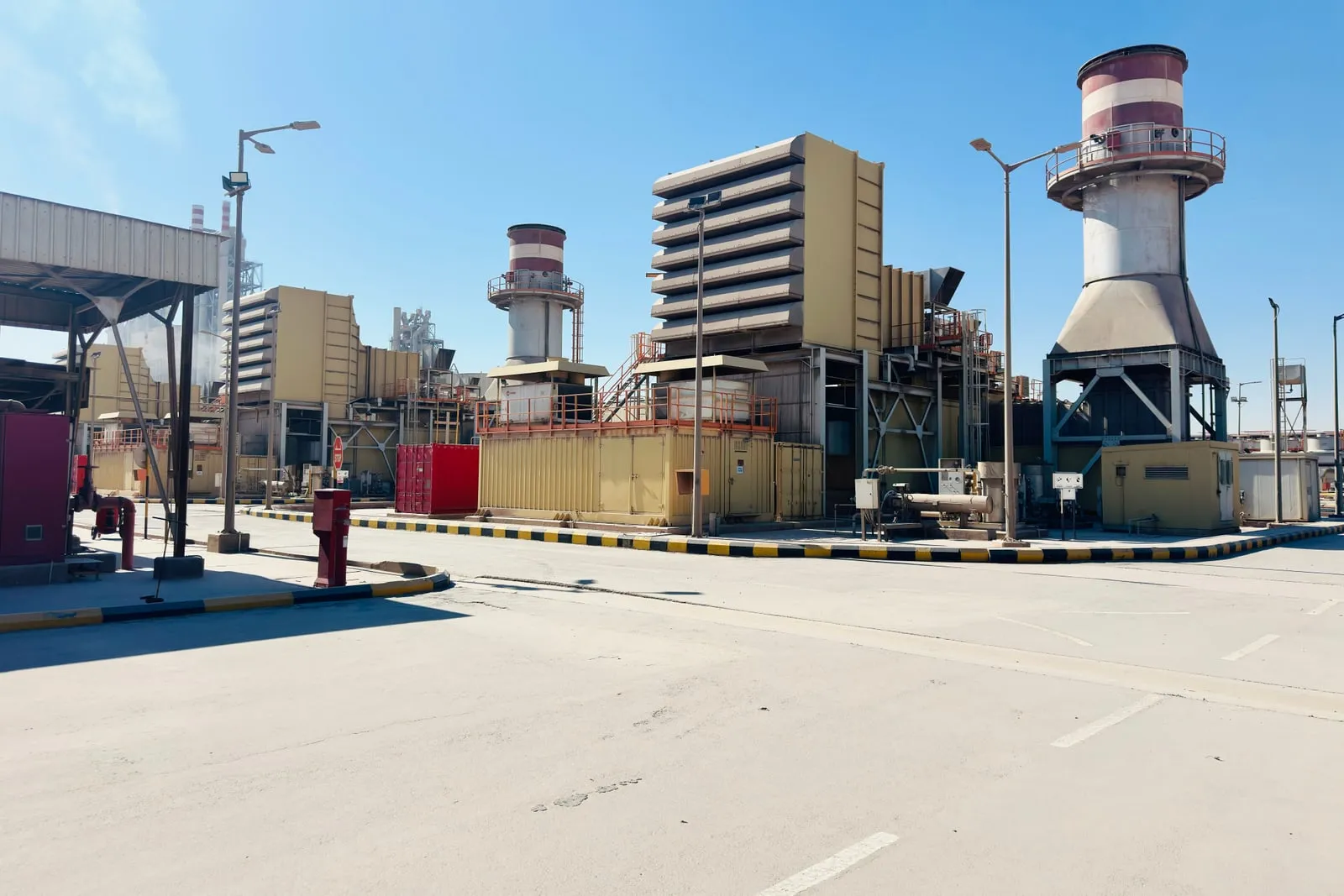 An industrial diesel generator unit outside a building