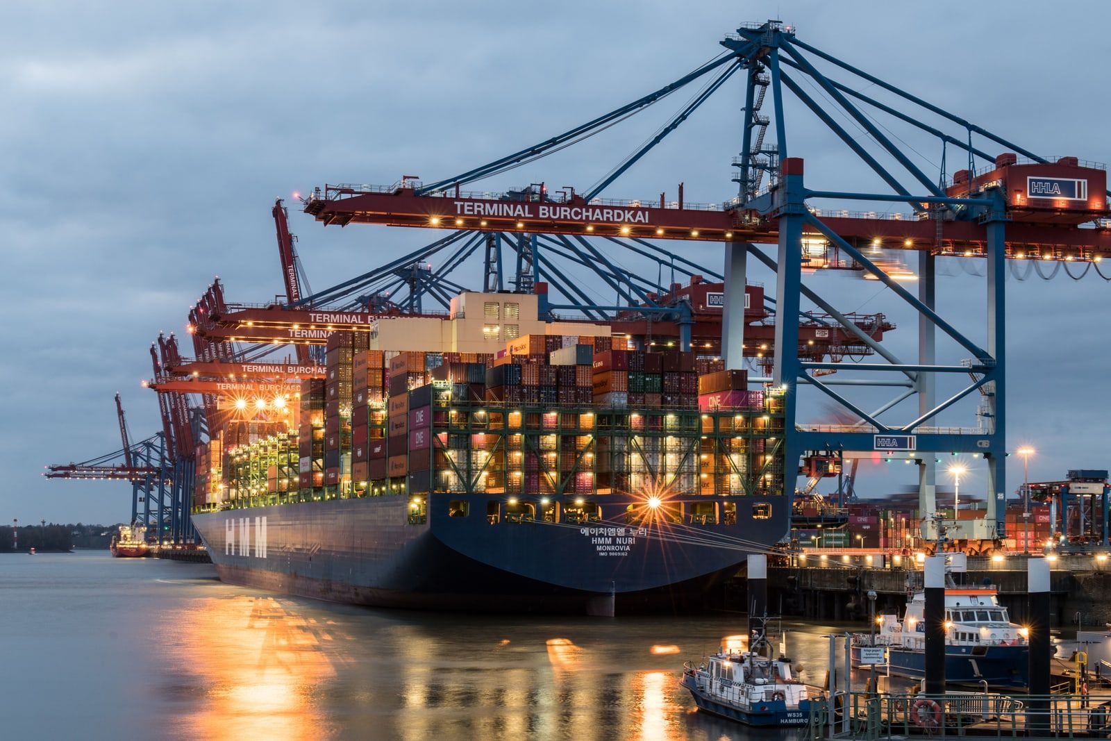 Cranes and container ships at a commercial port