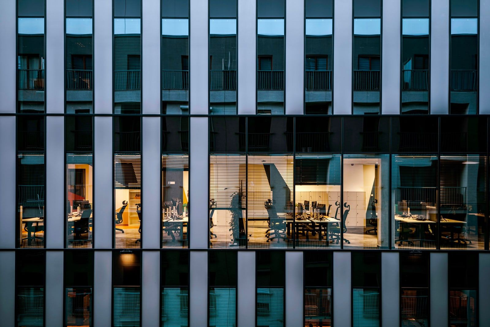 A glass-fronted corporate office building