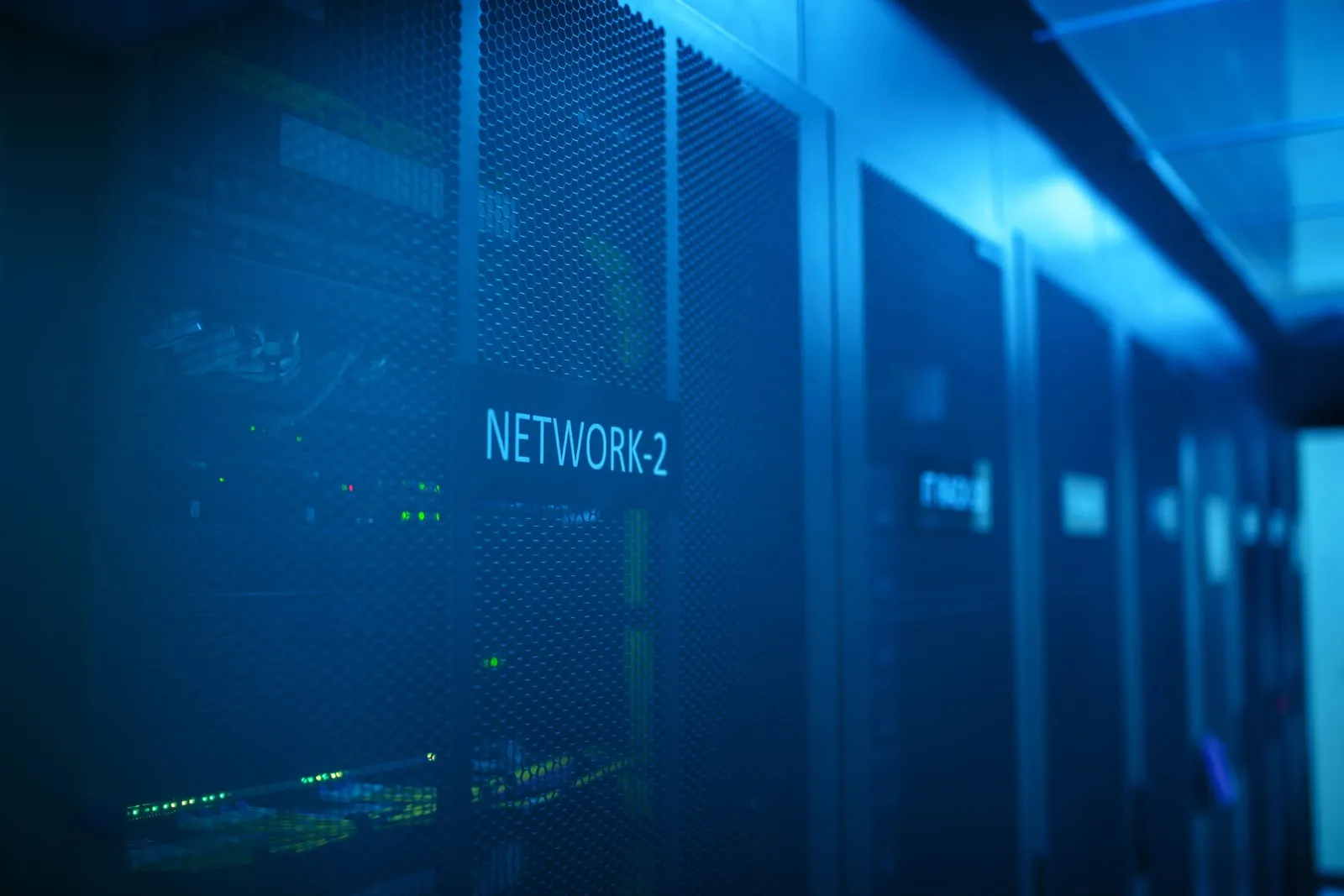 A server room lit with blue light