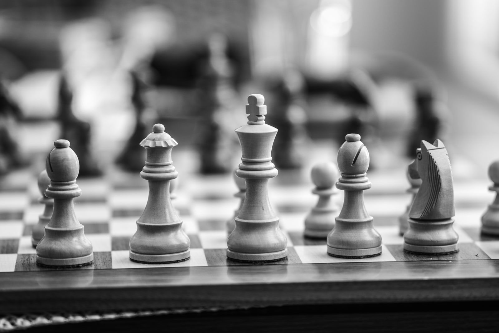 Chess pieces on a board, seen close up
