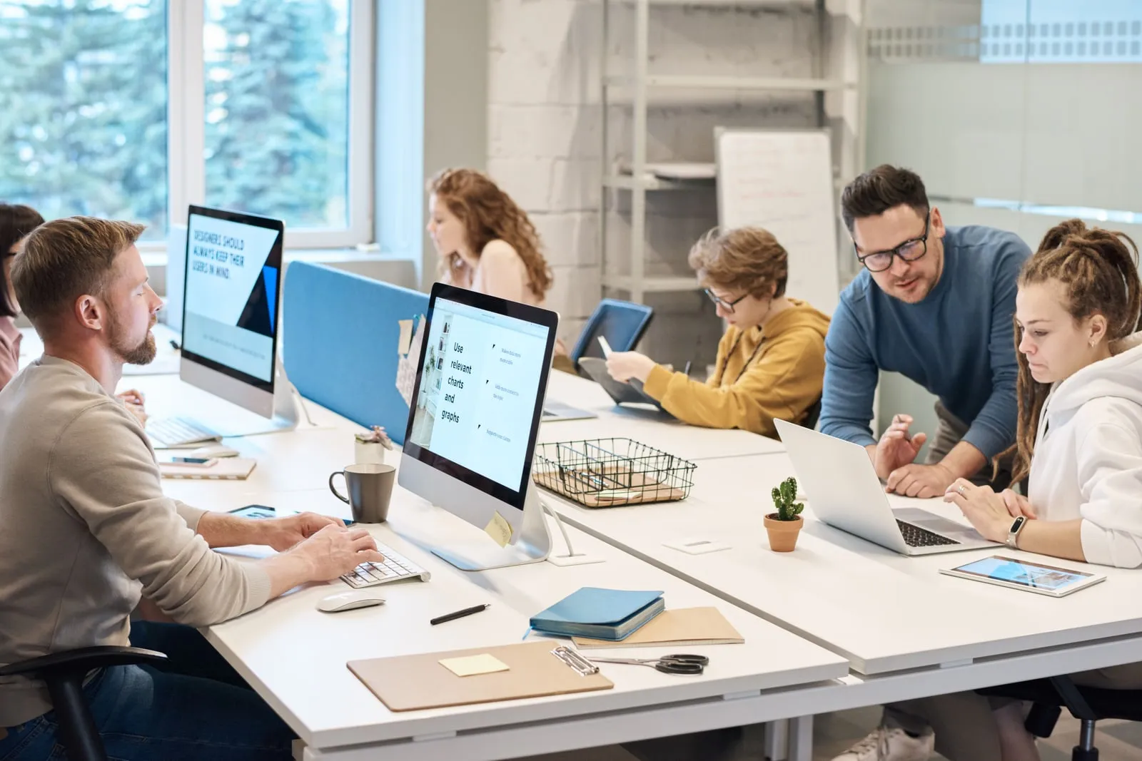 Office employees working at desktop computers