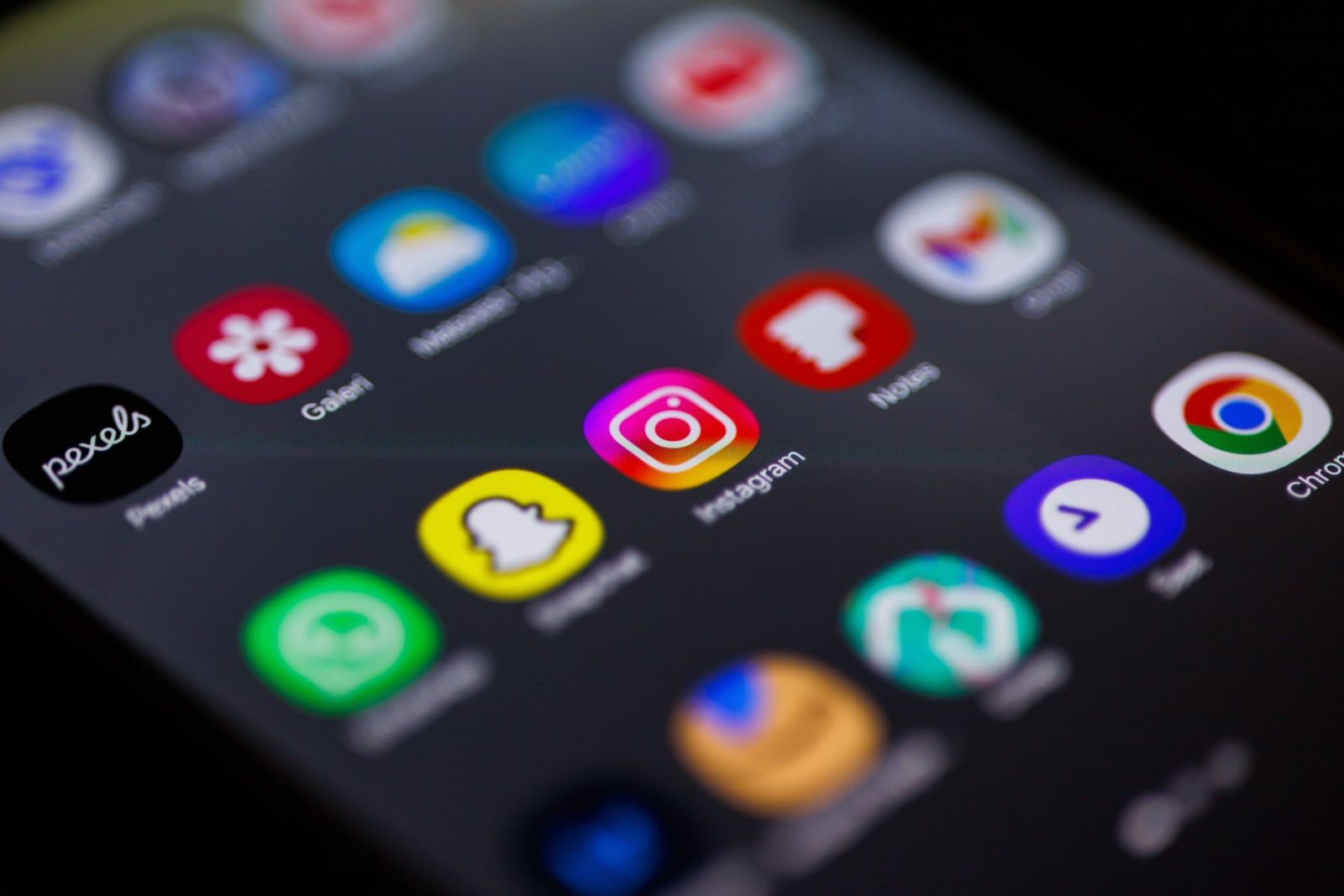 A smartphone home screen showing social media apps