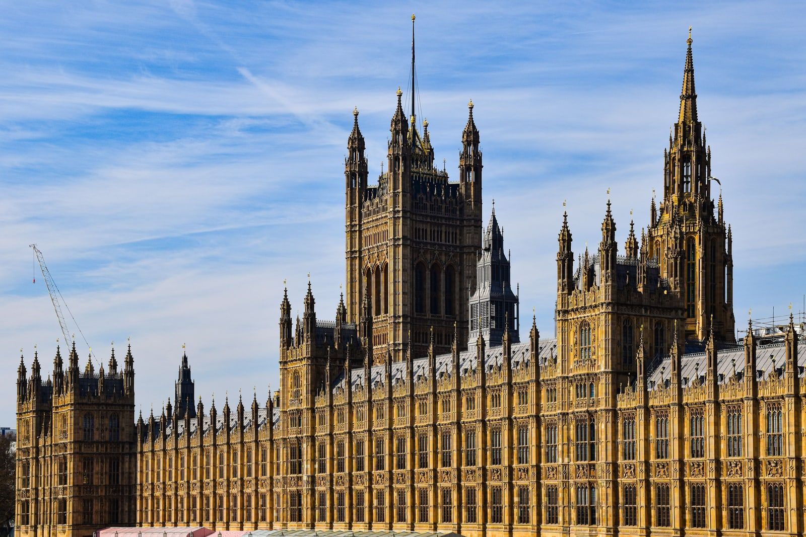 Palace of Westminster in London under a blue sky