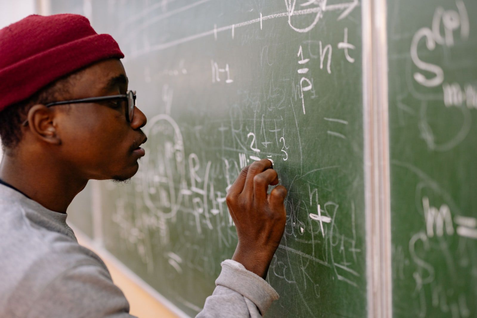 Mathematical equations written in chalk on a blackboard