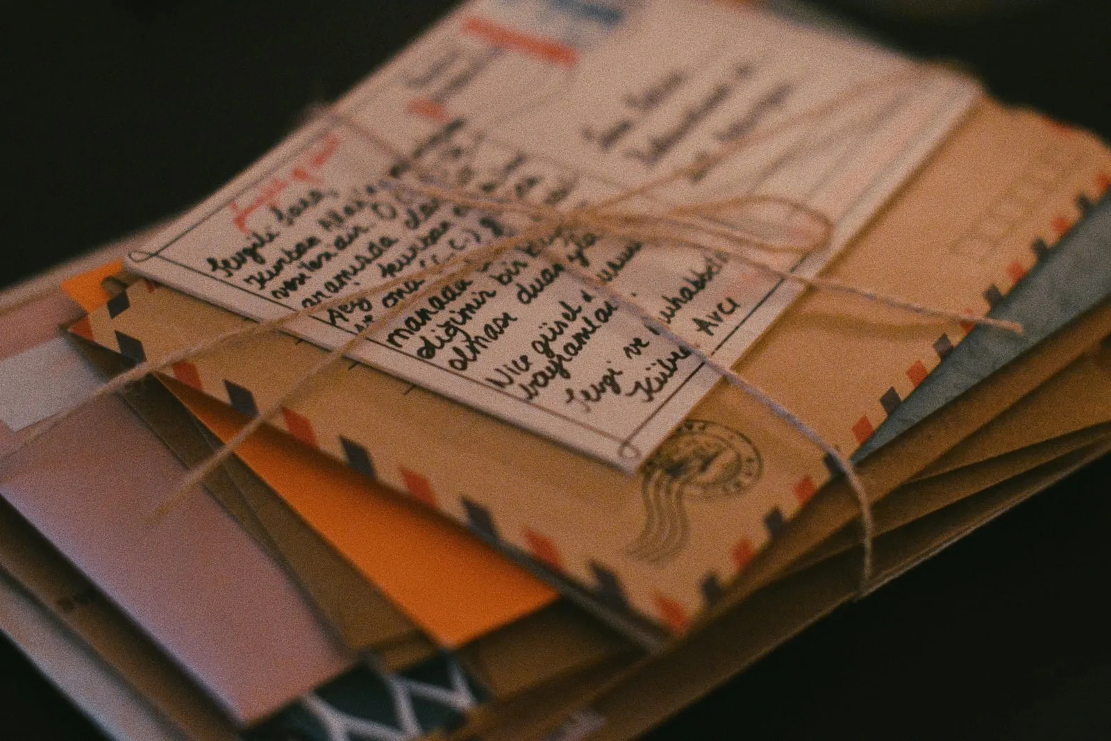 A stack of paper files tied with string