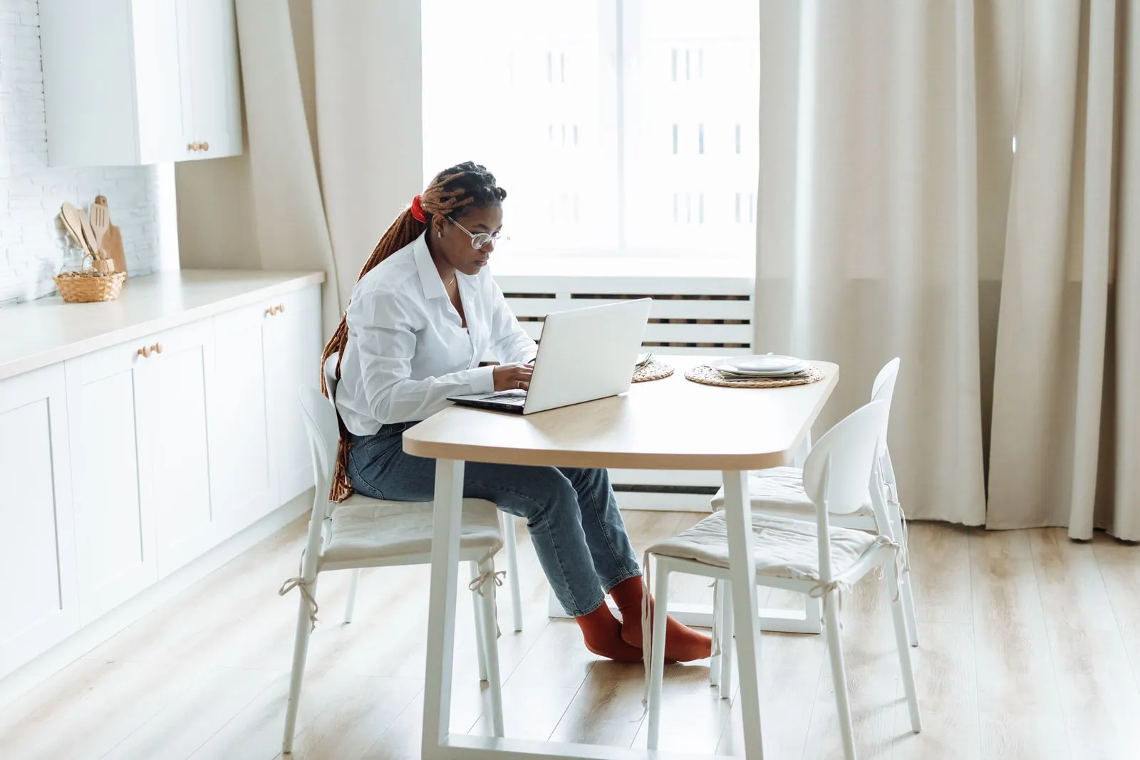 A person working from home at a kitchen table