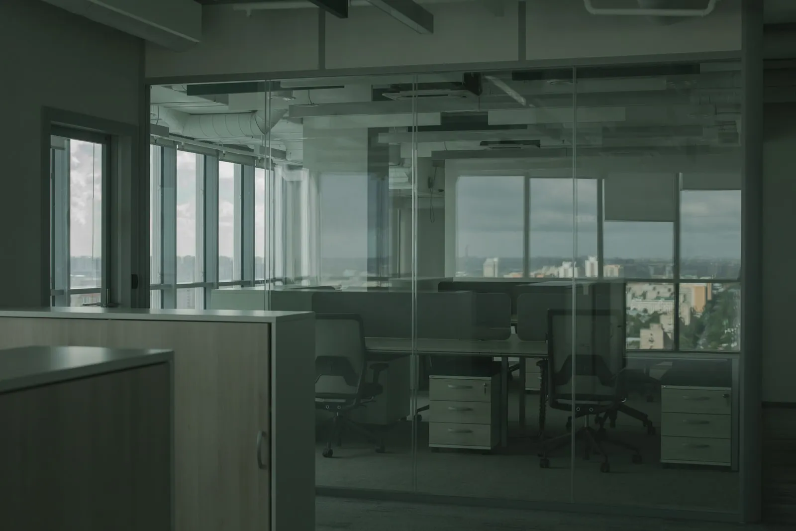 A glass partition wall inside a modern office