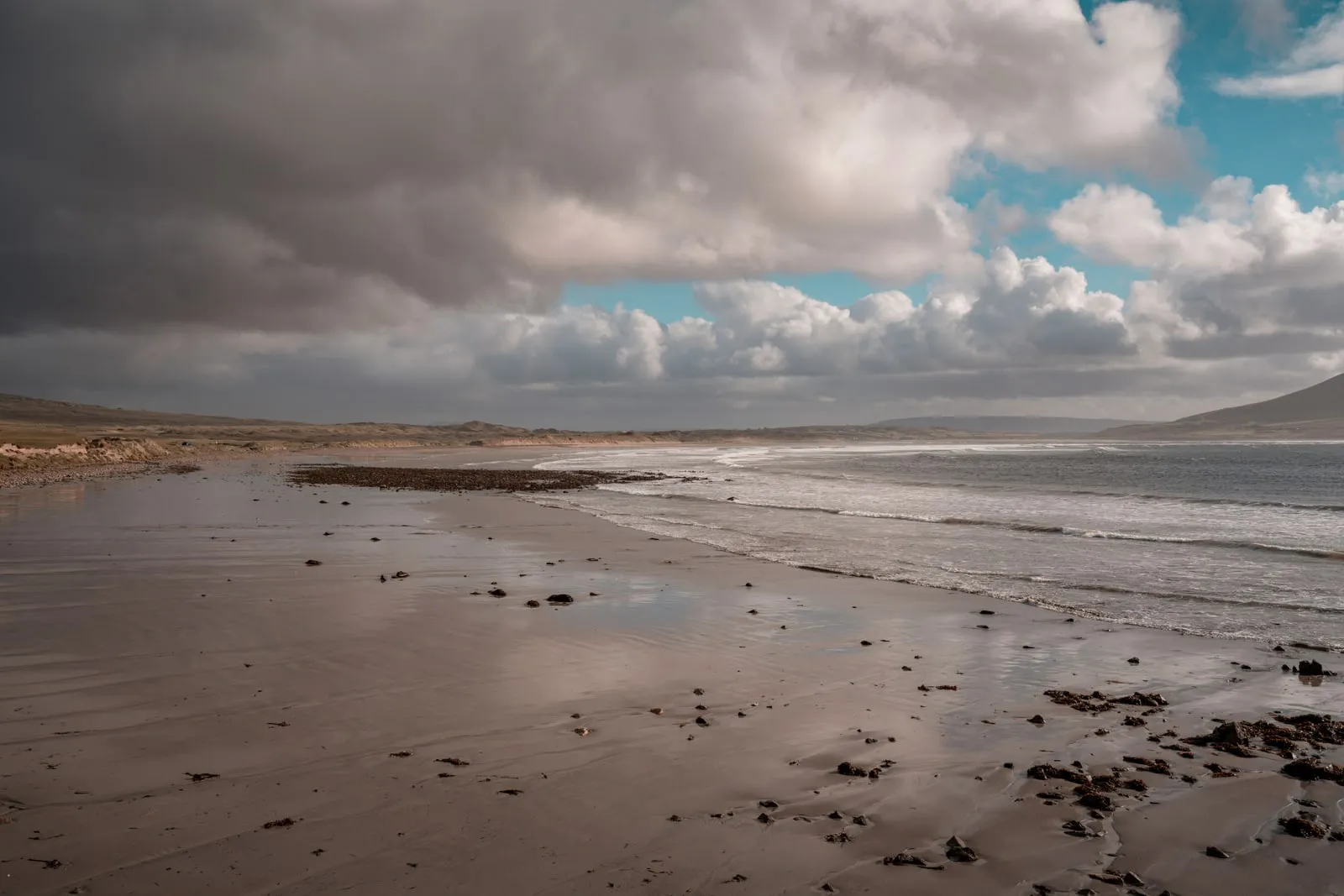 A beach on the west coast of Ireland under heavy cloud