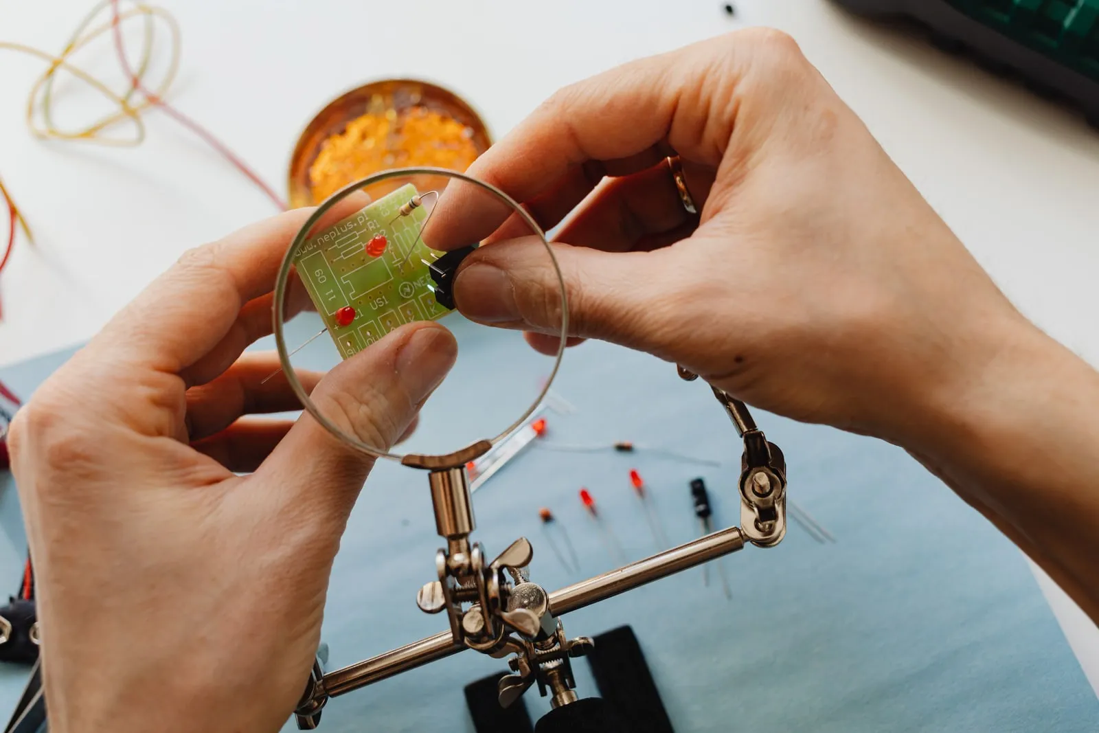 A circuit board being assembled on a workbench
