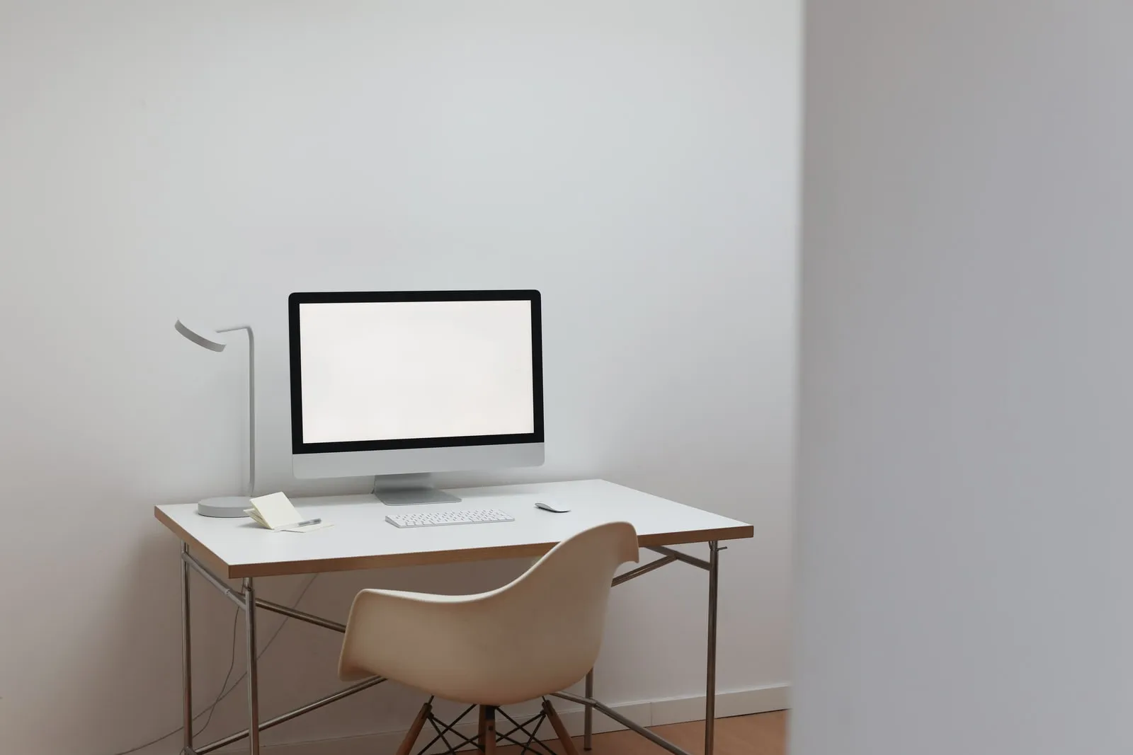 A computer monitor with a blank screen on a desk