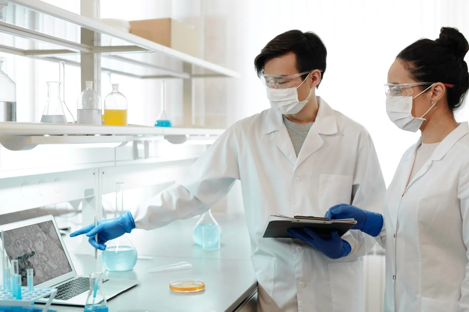 Researchers reviewing experimental results on a computer in a laboratory