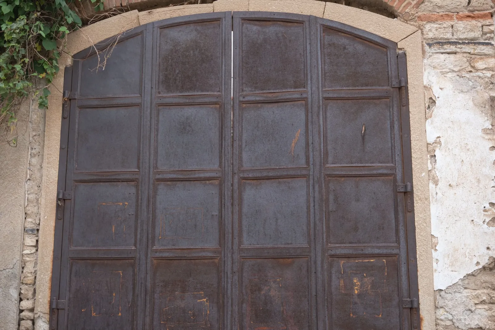 A closed metal gate in a doorway