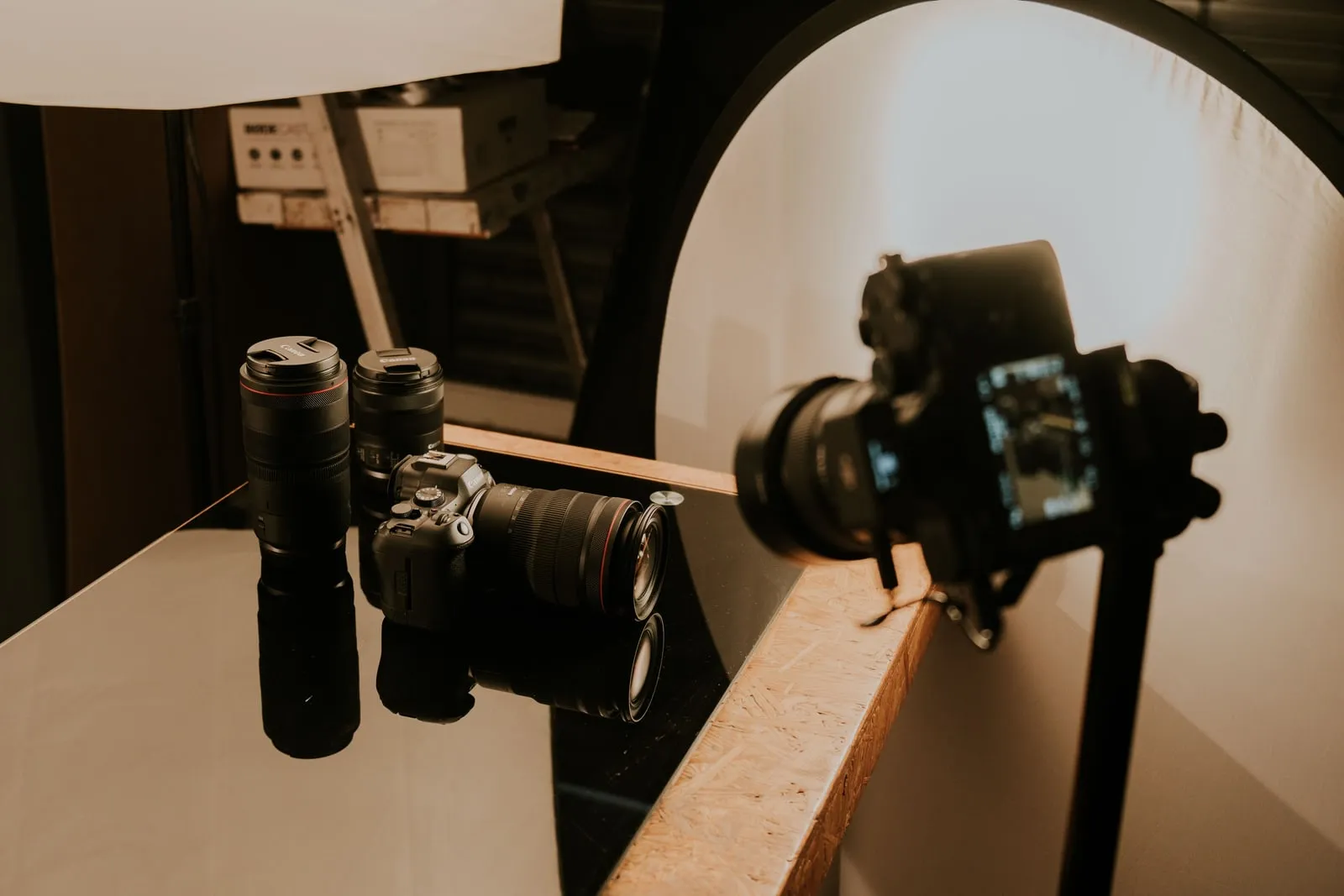 Camera bodies and lenses arranged on a studio table