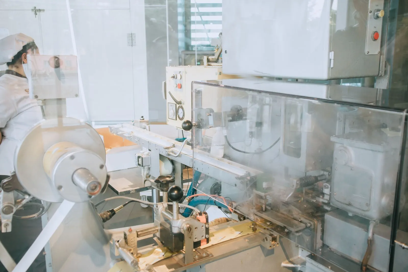 A worker operating production machinery