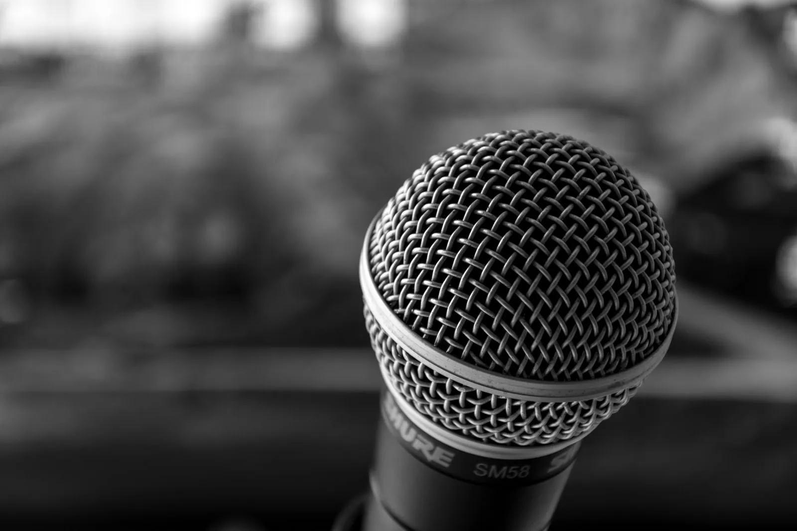 Microphones on a lectern at a press conference