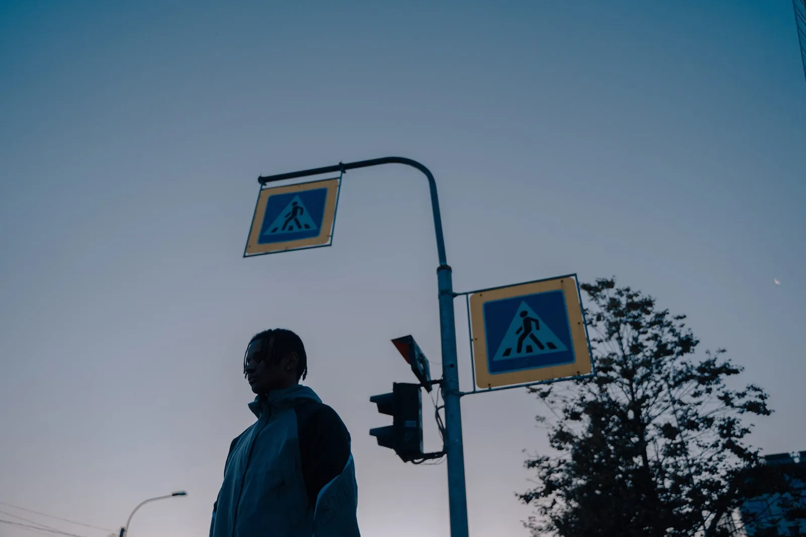 Traffic lights against a grey sky