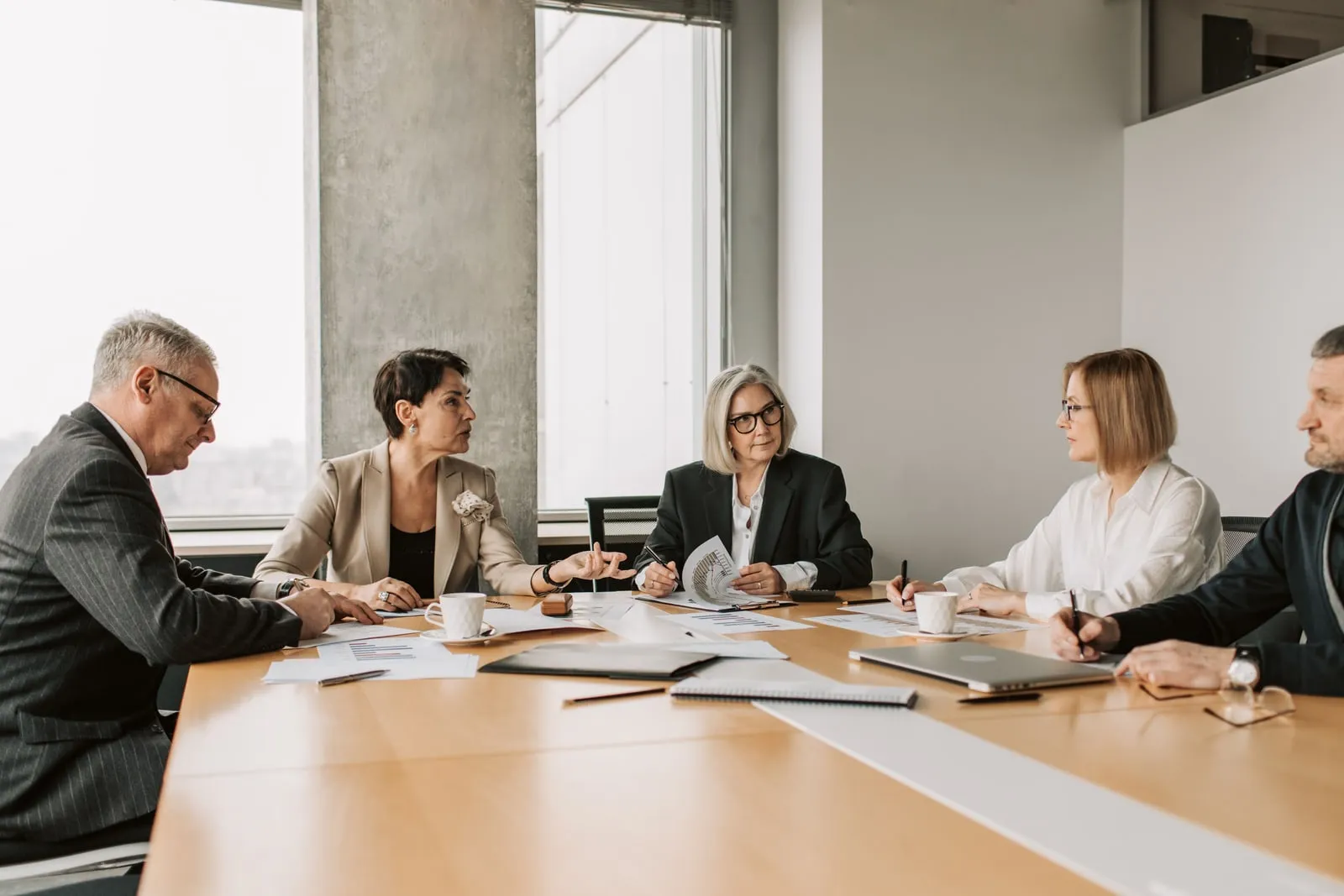 People talking around a table in an office meeting room