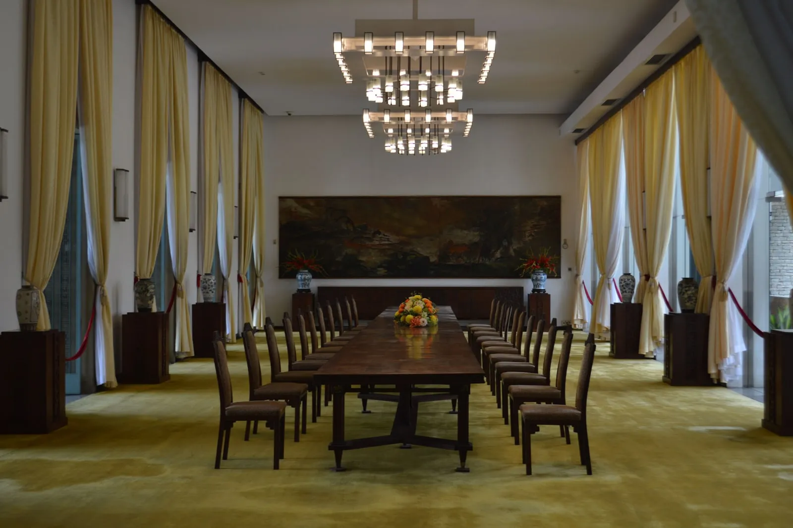 An empty meeting room with a long table