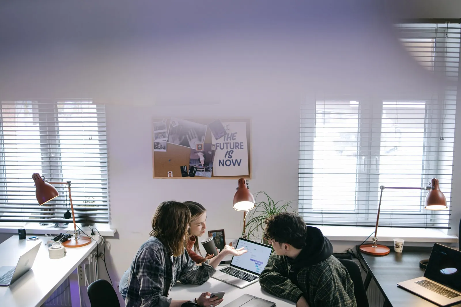 A team working at laptops in an open-plan office
