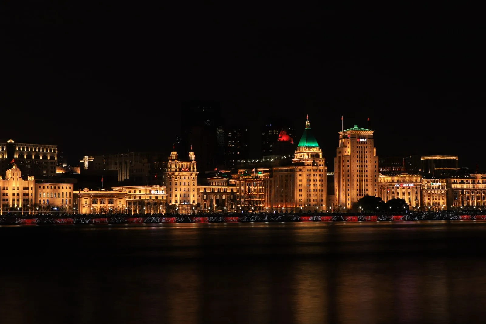 The Shanghai skyline at night seen across the water