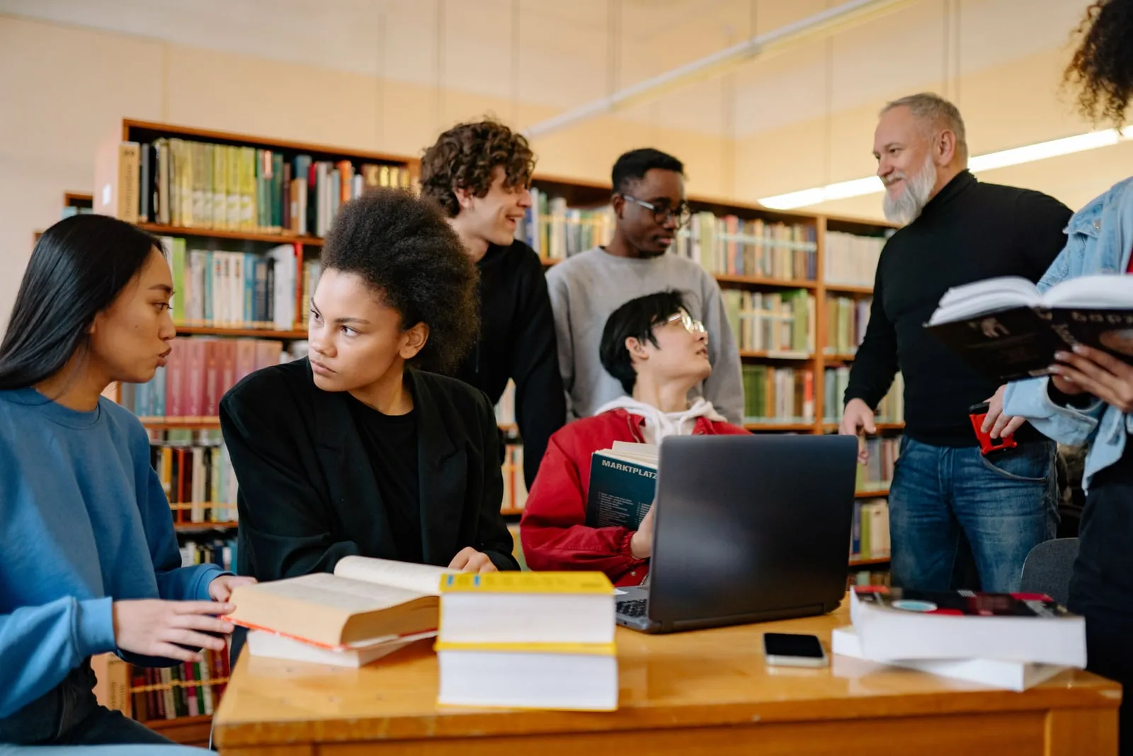Students studying at a library table