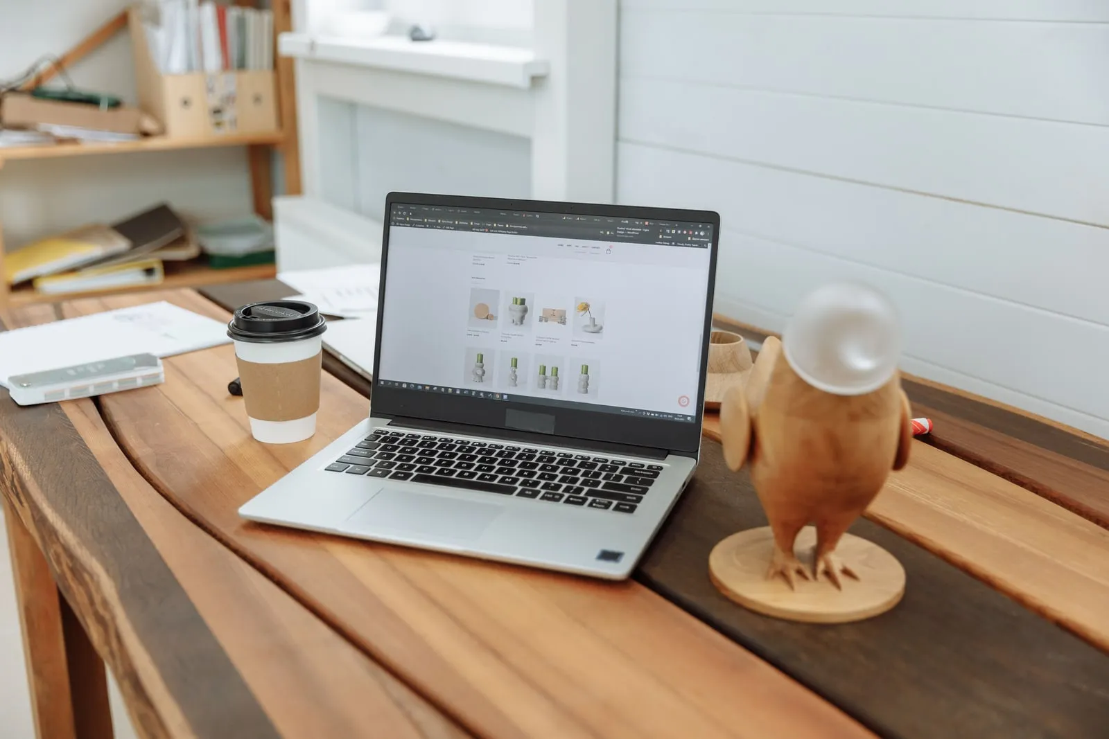 A laptop showing a website on a desk