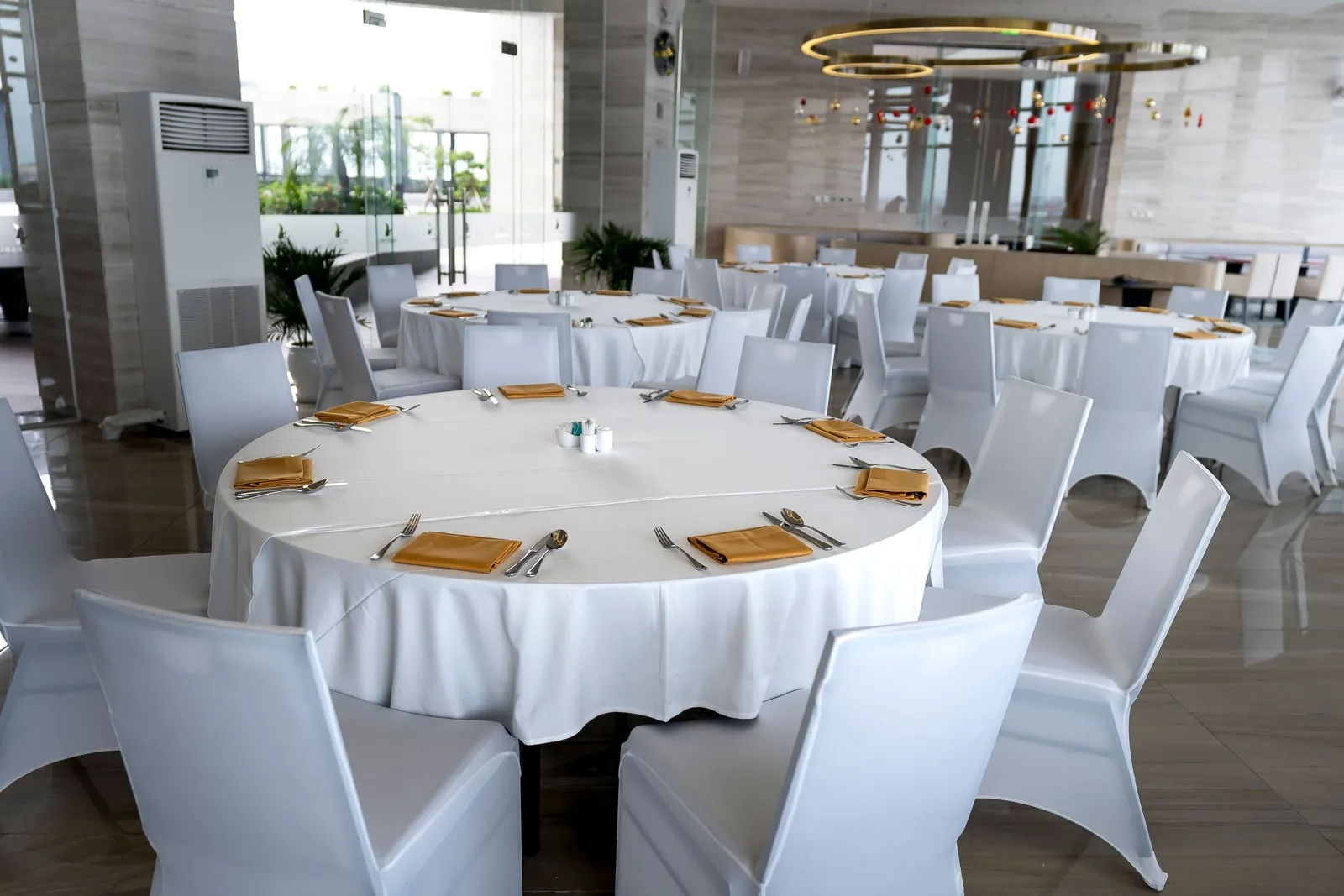 A formal dining table set with plates and glasses