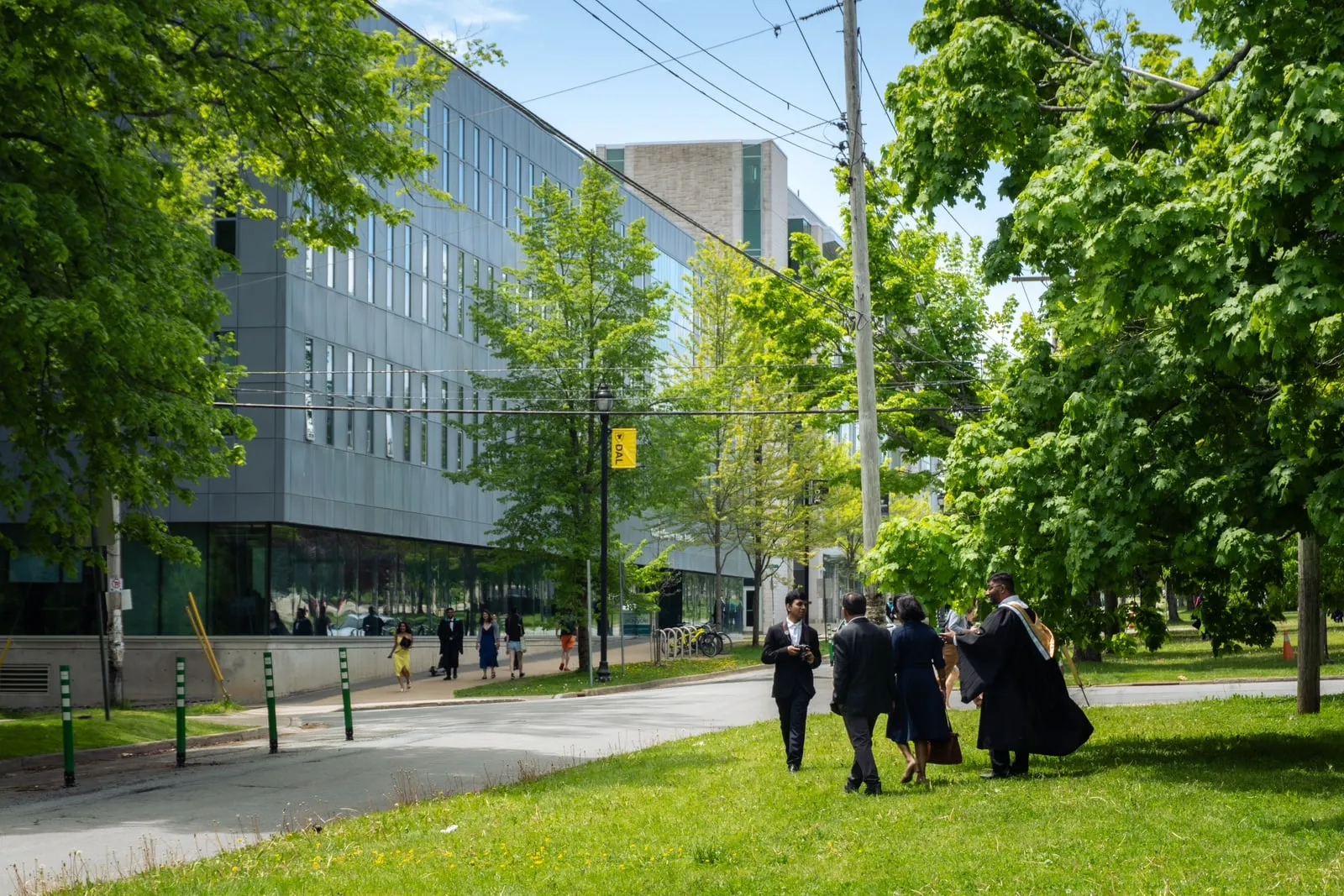 Graduates walking outside a university building