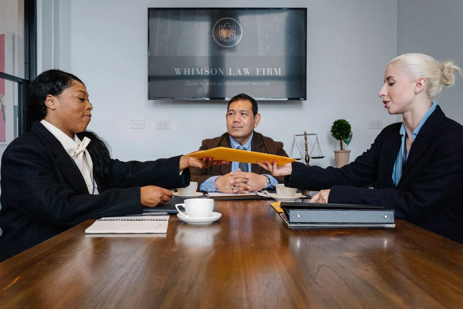 People in a meeting around a conference table