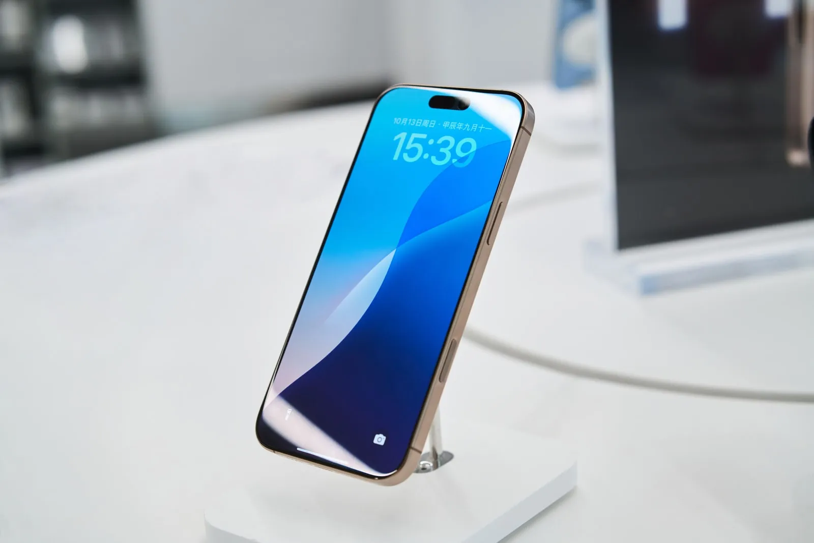 A smartphone standing on a display stand in a shop