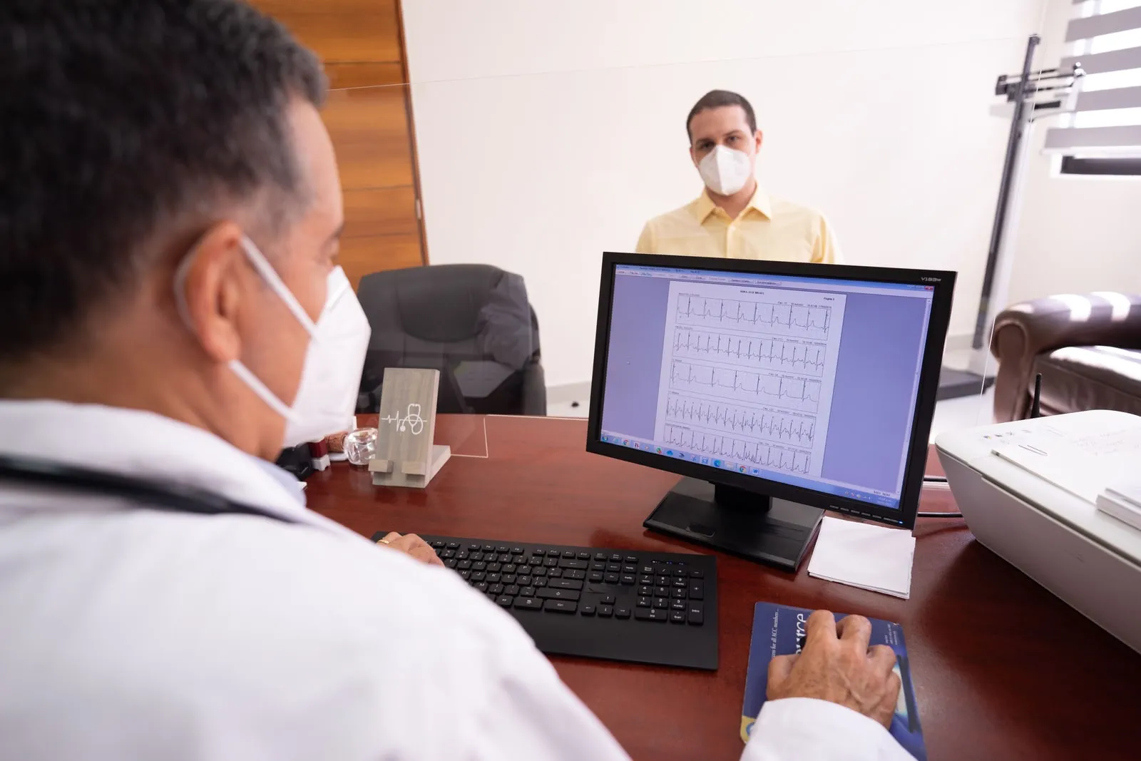 Two clinicians discussing results in a hospital office