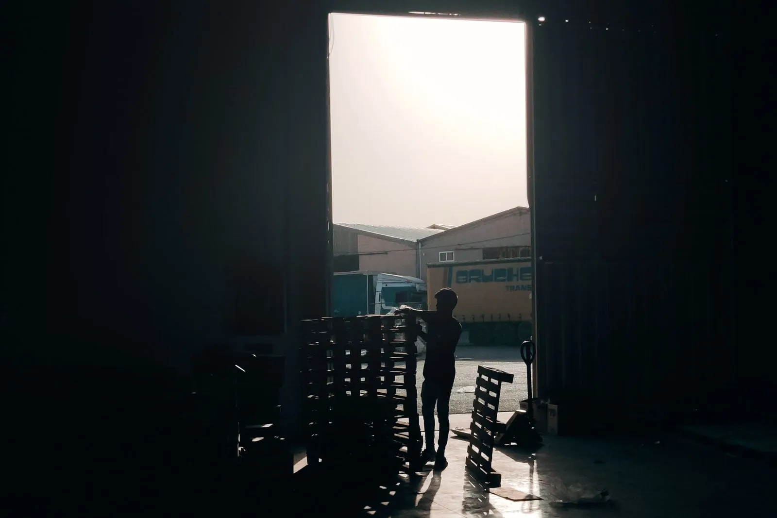 A warehouse robot moving a pallet