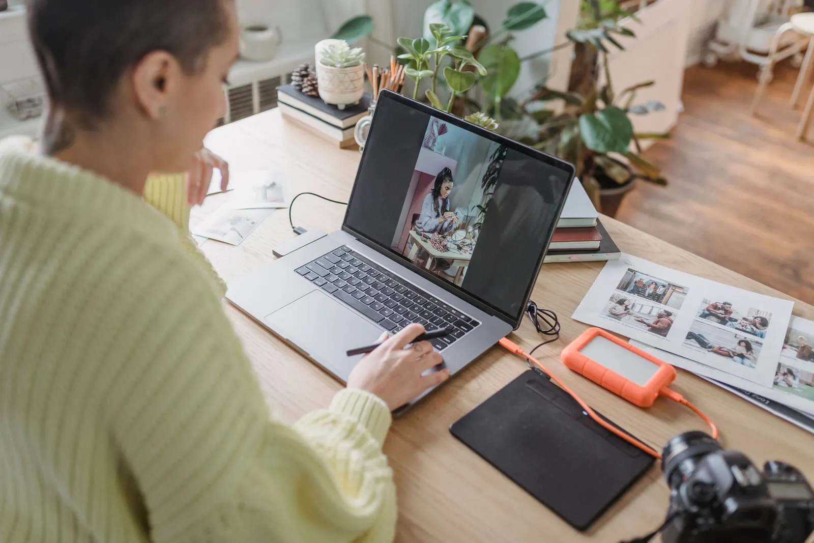 A person editing photographs on a computer screen