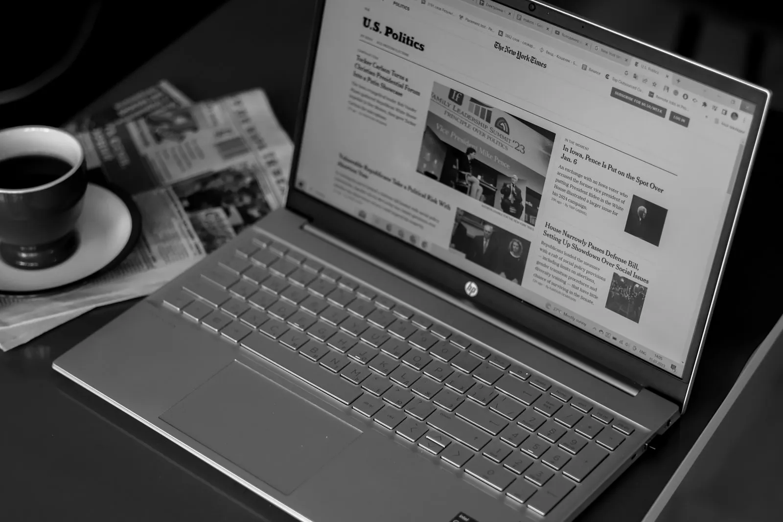 A person reading a news website on a laptop